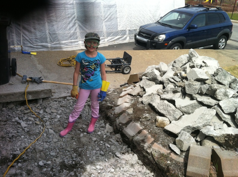 Fixing foundation cracks - Corina helps me break up some concrete!