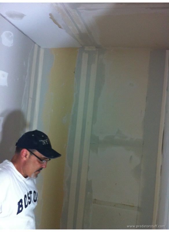 Getting the drywall mudding done! James working hard...