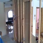 Tearing out the kitchen and small bedroom wall!