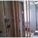 Tearing out the kitchen and small bedroom wall!