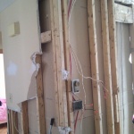 Tearing out the kitchen and small bedroom wall!