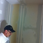 Getting the drywall mudding done! James working hard...