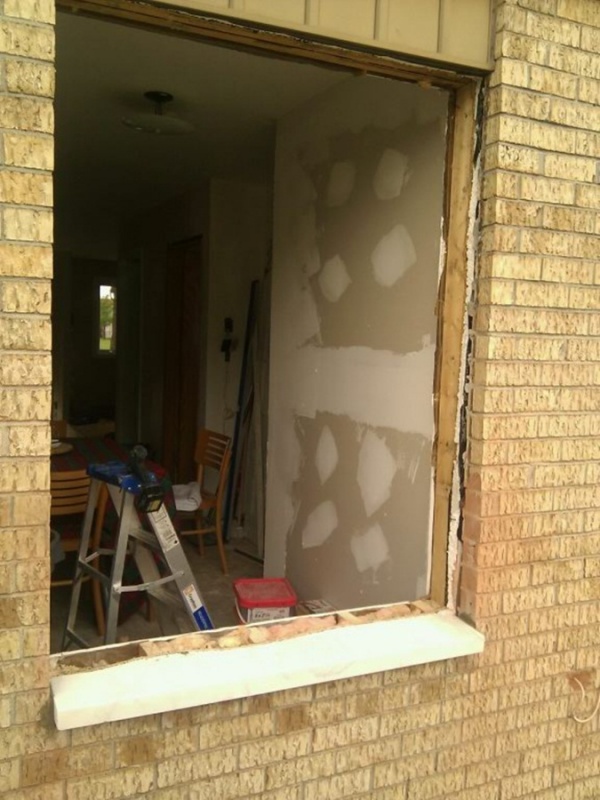 Dining room window being prepped... had to cut the bricks to make the window lower.