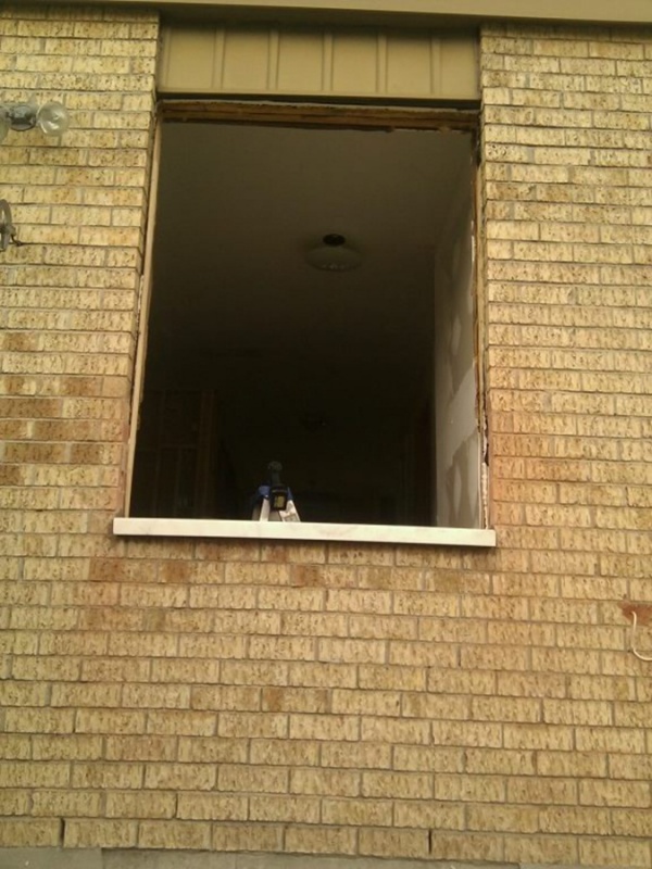 Dining room window being prepped... had to cut the bricks to make the window lower.