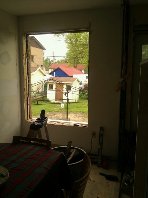 Dining room window being prepped... had to cut the bricks to make the window lower.