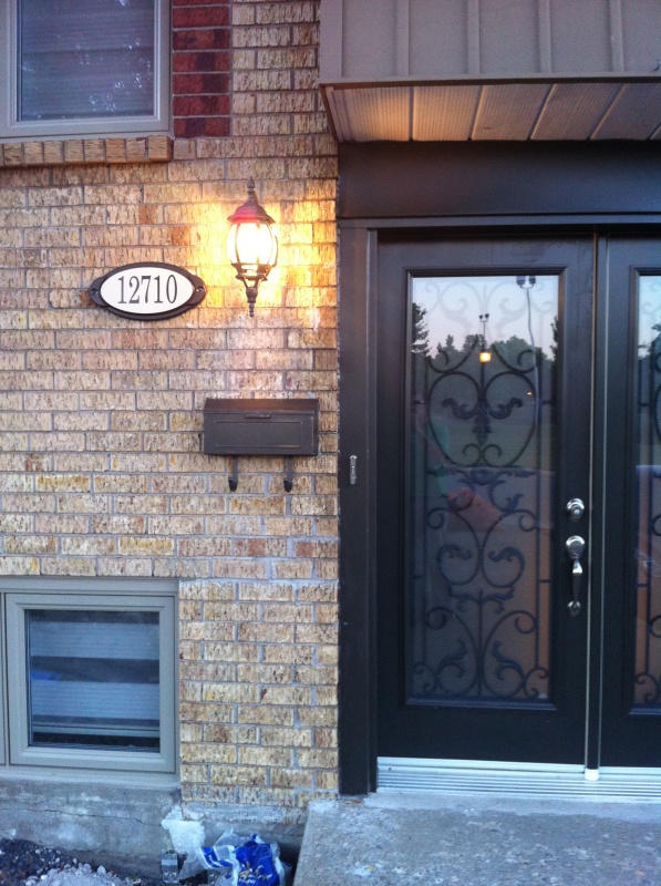 New light, address sign and mailbox to match the doors and windows.