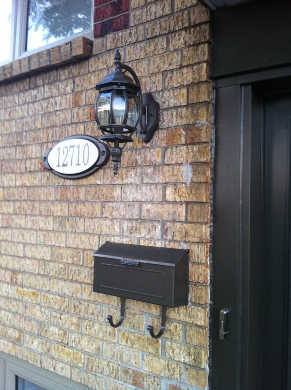 New light, address sign and mailbox to match the doors and windows.