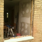 Dining room window being prepped... had to cut the bricks to make the window lower.