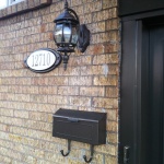 New light, address sign and mailbox to match the doors and windows.